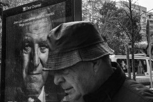 Black and white man under the rain coat hat